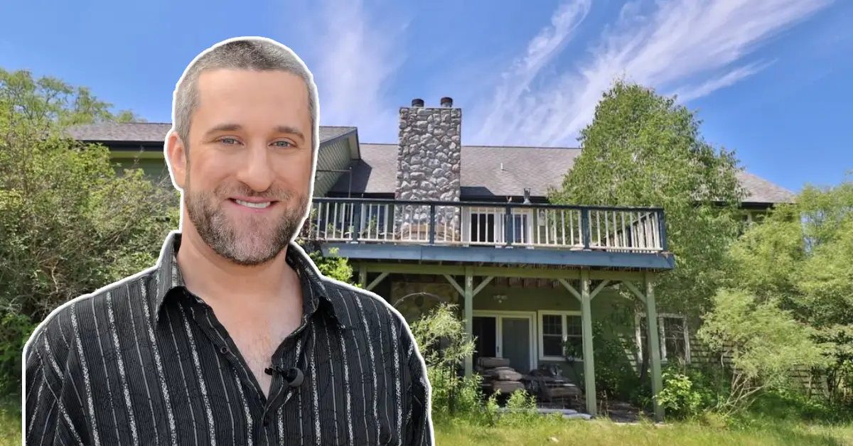 Dustin Diamond House with stone chimney, spacious upper deck, and lush greenery, highlighting the iconic home’s exterior in Port Washington.