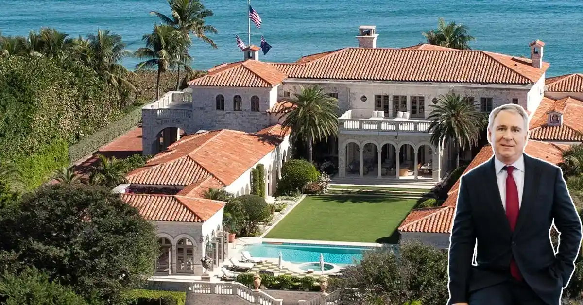 Kenneth Griffin standing next to his luxurious Palm Beach oceanfront mansion with red tile roof, swimming pool, and tropical landscaping