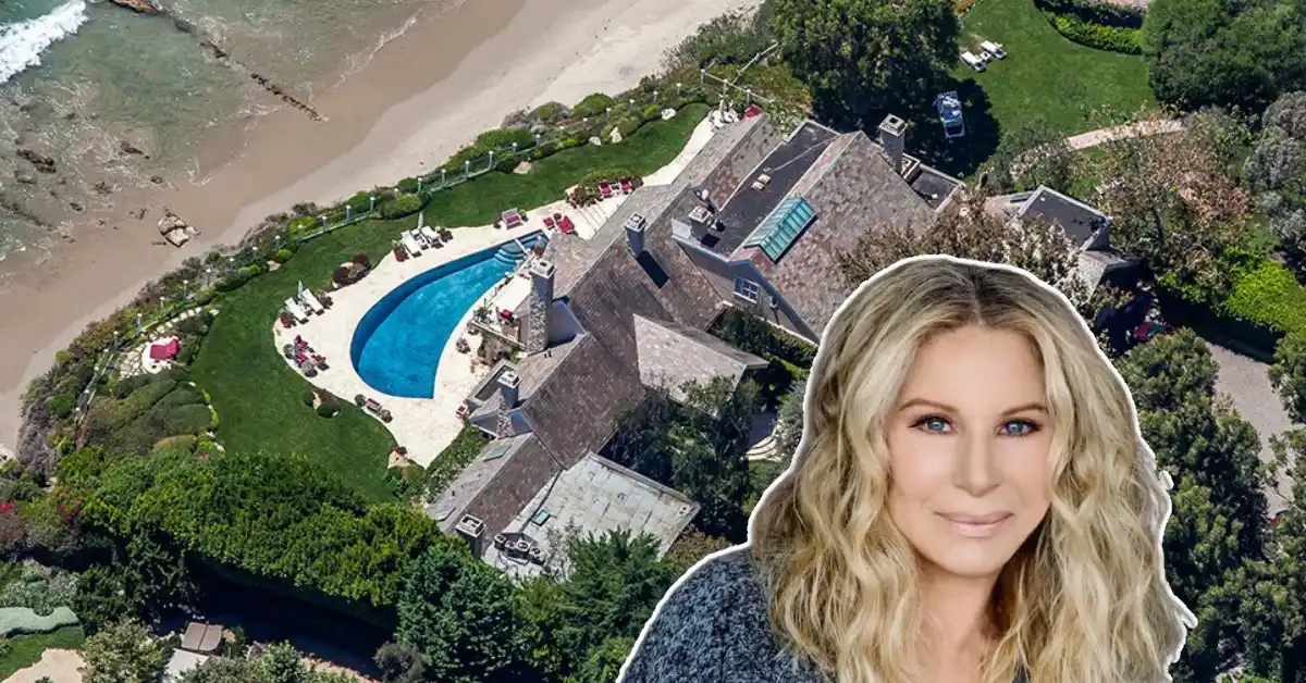 Barbara Streisand House in Malibu - aerial view of the coastal compound featuring stone-roofed main residence, curved swimming pool, and private beach access