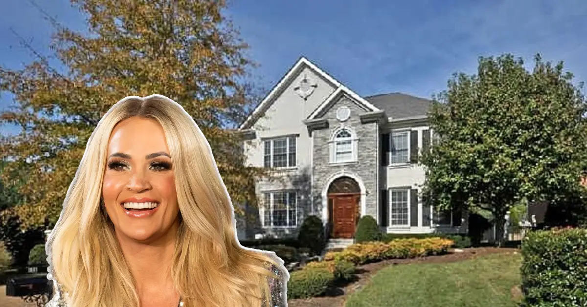 Front view of the Carrie Underwood House showcasing its elegant farmhouse design and lush Tennessee surroundings.