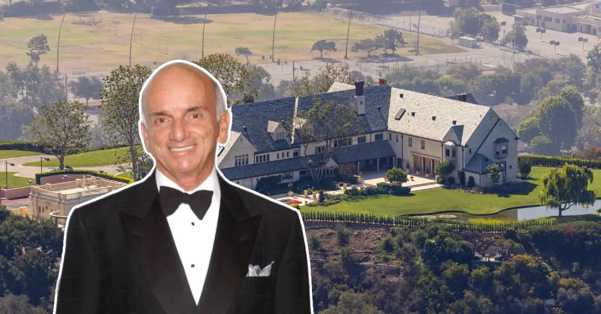 Aerial view of the Dennis Tito House, a luxurious Pacific Palisades mansion surrounded by lush gardens and panoramic Los Angeles scenery.